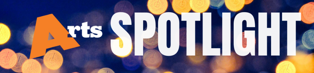 Arts Spotlight written on a dark blue background with unfocused orbs of light