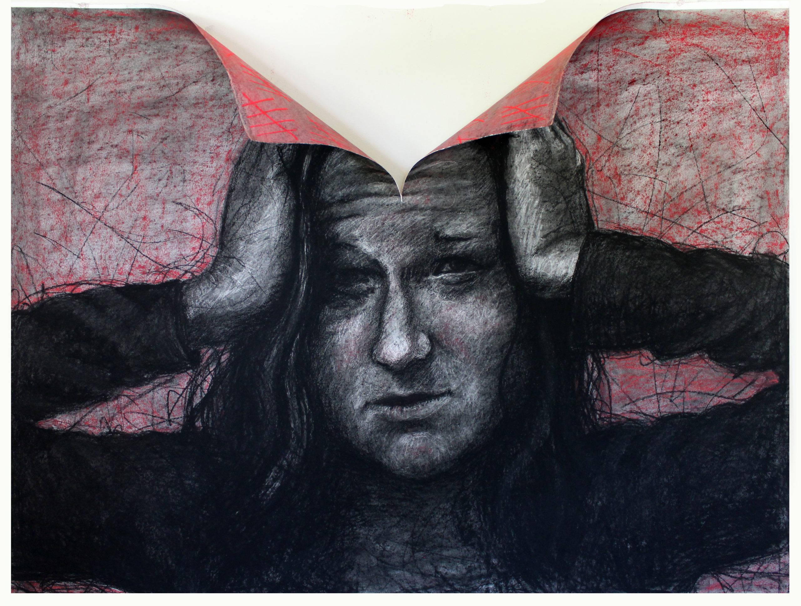 A drawing of a woman with her hands on either side of her heard and the paper is torn in the center to her forehead
