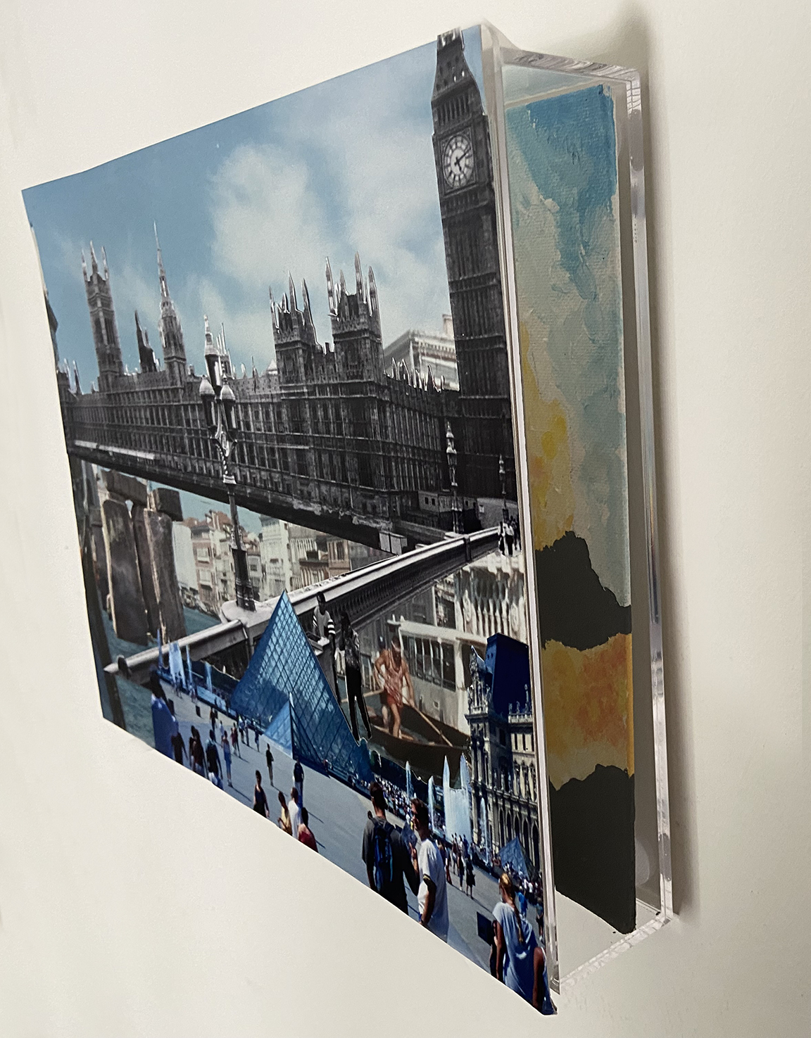 A collage of photographs with European landmarks, in front of a separate canvas with an acrylic heat map painting.