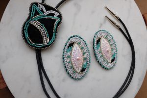 Renita Coursey PowWow Style Cabs/Bolo Set, 2024 Brain tanned black deer hide & Czech seed beads, sterling silver findings 4 x 3 inches