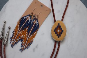 Renita Coursey Burnt Brown Bolo/Earring Set, 2024 Miyuki Delica Size 11/0 Beads with Brain tanned deer hide and Nymo B thread 5 x 2 ½ inches