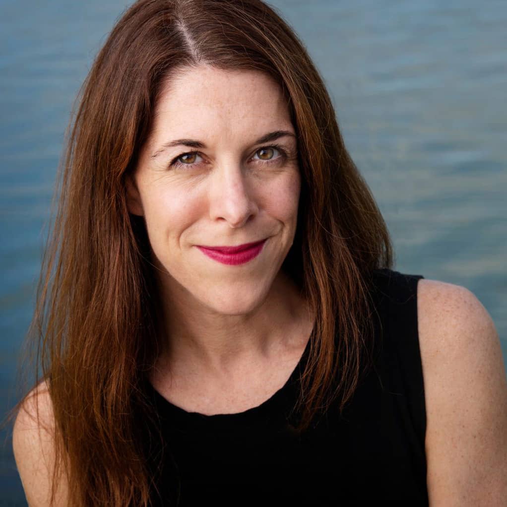 Catherine Pierce - environmental portrait with water behind. (photo by Megan Bean / © Mississippi State University)