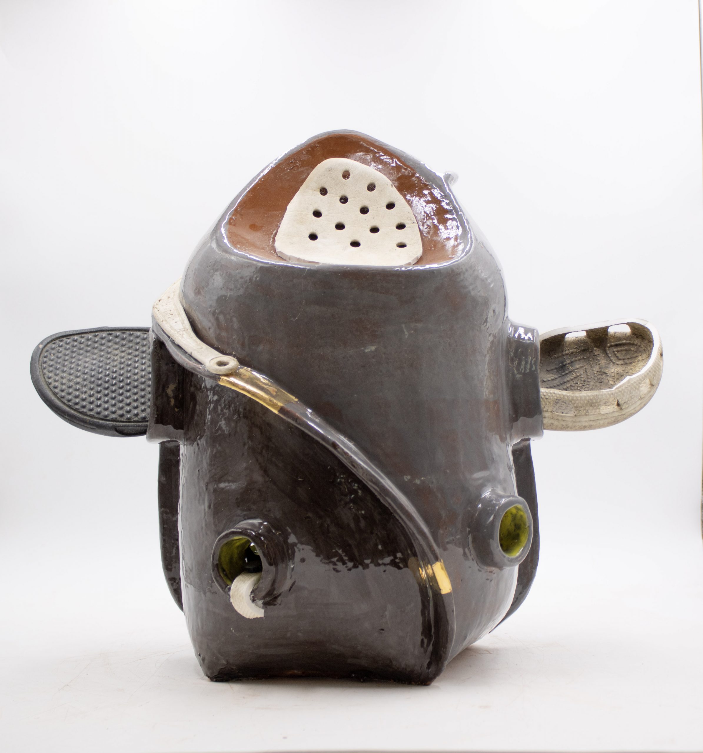 “Efie nie fie” (2026), Earthenware Red Clay, glaze, gold luster, and found objects, 24”x24”x15”.