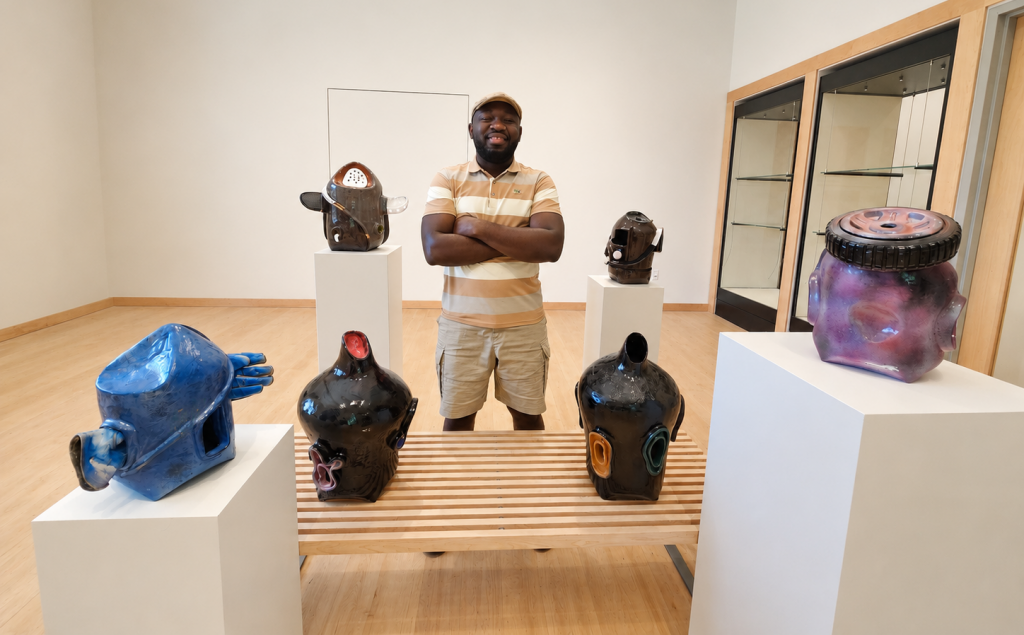 Teddy Osei among pottery